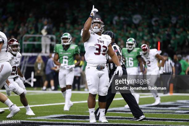 Josh Anderson of the Troy Trojans celebrates a touchdown during the first half of the R+L Carriers New Orleans Bowl against the North Texas Mean...