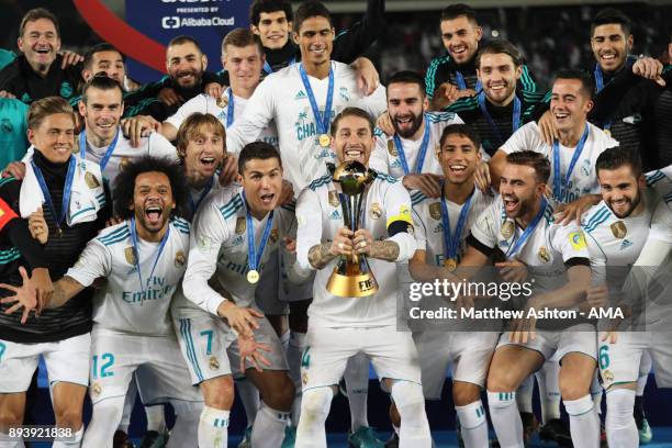 Sergio Ramos of Real Madrid lifts the trophy with his team-mates at the end of the FIFA Club World Cup UAE 2017 final match between Gremio and Real...
