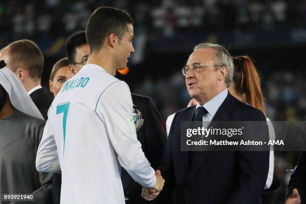 Cristiano Ronaldo of Real Madrid shakes hands with Real Madrid President Florentino Perez at the end of the FIFA Club World Cup UAE 2017 final match...