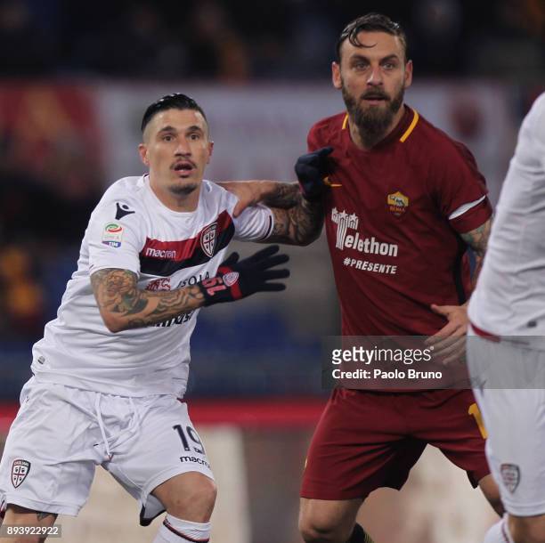 Fabio Pisacane of Cagliari Calcio competes for the ball with Daniele De Rossi of AS Roma during the Serie A match between AS Roma and Cagliari Calcio...