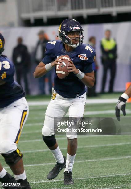 Lamar Raynard drops back to pass during the bowl game between the North Carolina A&T Aggies and the Grambling State Tigers on December 16, 2017 at...