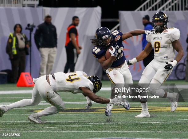 Marquell Cartwright dodges a tackle during the bowl game between the North Carolina A&T Aggies and the Grambling State Tigers on December 16, 2017 at...