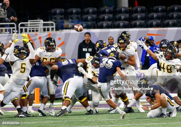 Noel Ruiz kicks the point after touchdown to seal the win during the bowl game between the North Carolina A&T Aggies and the Grambling State Tigers...