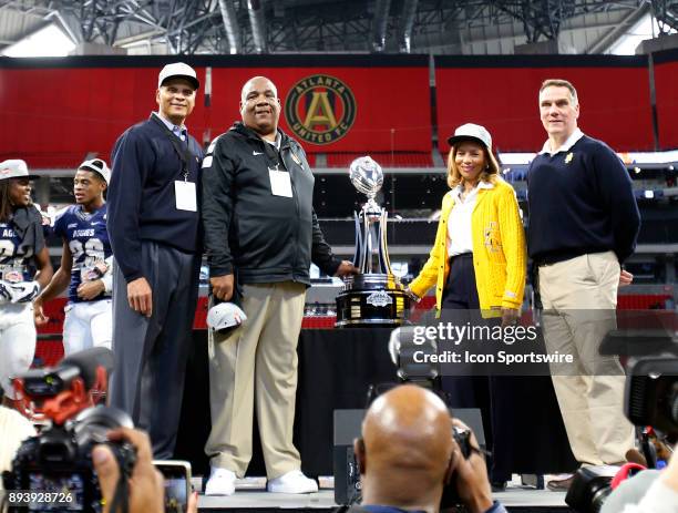 Head coach Rod Broadway and the championship trophy after the Aggies won the bowl game between the North Carolina A&T Aggies and the Grambling State...