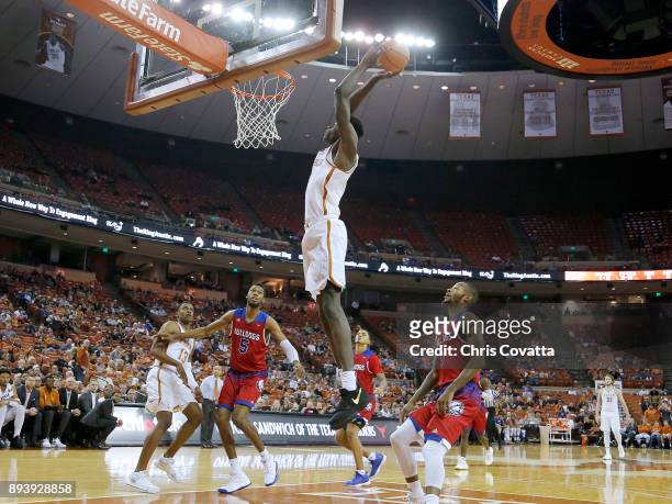 Mohamed Bamba of the Texas Longhorns slam dunks while surrounded by Joniah White, Jalen Harris and Jacobi Boykins of the Louisiana Tech Bulldogs of...
