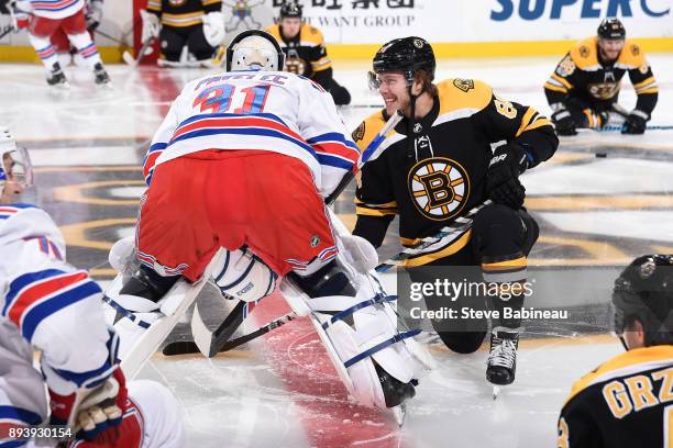 Ondrej Pavelec of the New York Rangers chats with David Pastrnak of the Boston Bruins before the game at the TD Garden on December 16, 2017 in...