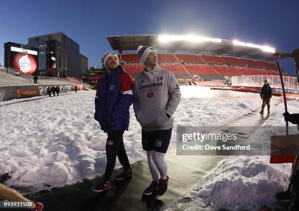 Andrew Shaw and Charles Hudon of the Montreal Canadiens check out the stadium in advance of the 2017 Scotiabank NHL100 Classic at Lansdowne Park on...