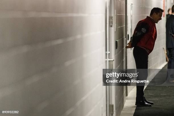 Guy Boucher, head coach of the Ottawa Senators waits outside the locker room prior to the 2017 Scotiabank NHL100 Classic at Lansdowne Park on...