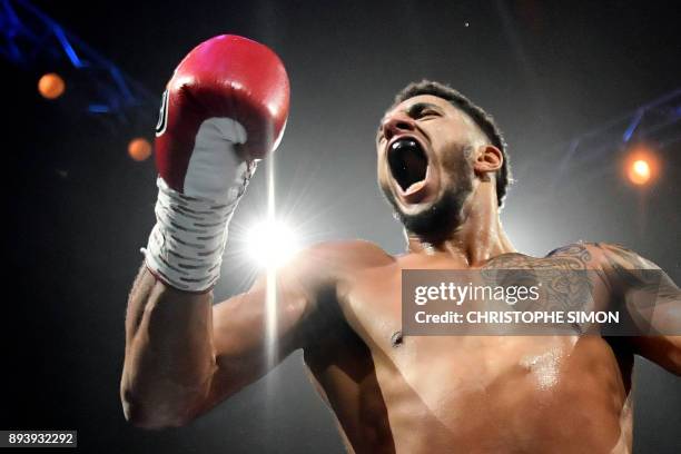 France's Tony Yoka celebrates after winning his Heavy weight boxing bout against Belgium's Ali Baghouz, on December 16, 2017 in Boulogne-Billancourt....