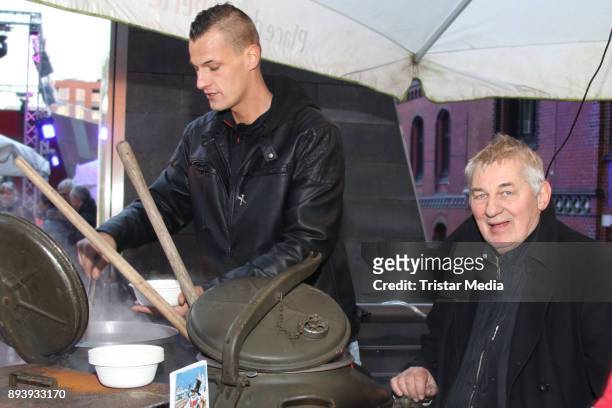 German actor Heinz Hoenig and his son Lukas Hoenig sell homemade pea soup for the campaign 'Kinder schmieden Zukunft' on December 16, 2017 in...