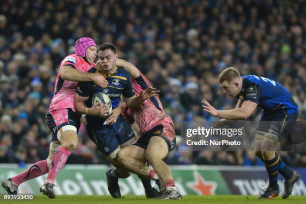 James Ryan of Leinster team in action challenged by Tom Waldrom and Sam Simmonds of Exeter Chiefs during the European Rugby Champions Cup rugby match...