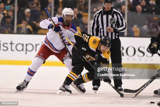 Sean Kurlay of the Boston Bruins against Boo Nieves of the New York Rangers at the TD Garden on December 16, 2017 in Boston, Massachusetts.