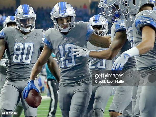 The Detroit Lions celebrate a touchdown by T.J. Jones of the Detroit Lions during the first half against the Chicago Bears at Ford Field on December...