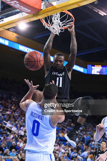 Cincinnati forward Gary Clark dunks on UCLA forward Alex Olesinski during an college basketball game between the Cincinnati Bearcats and the UCLA...