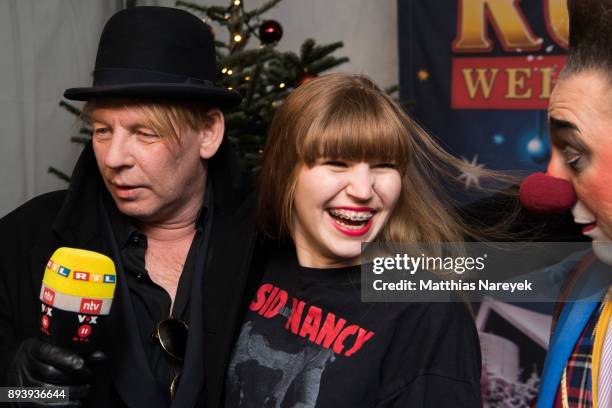 Ben Becker, his daughter Lilith Becker and a clown attend the 14th Roncalli Christmas at Tempodrom on December 16, 2017 in Berlin, Germany.