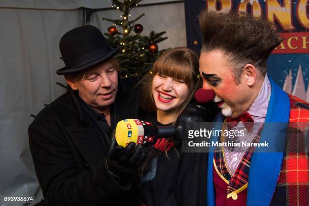 Ben Becker, his daughter Lilith Becker and a clown attend the 14th Roncalli Christmas at Tempodrom on December 16, 2017 in Berlin, Germany.