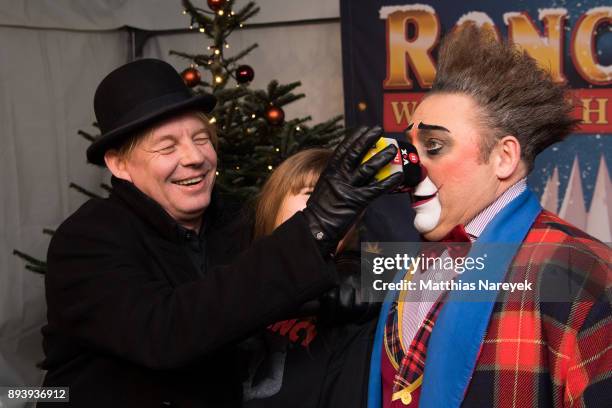 Ben Becker, his daughter Lilith Becker and a clown attend the 14th Roncalli Christmas at Tempodrom on December 16, 2017 in Berlin, Germany.