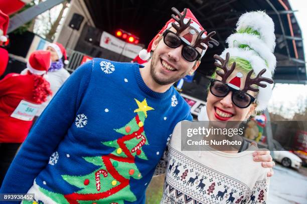 People take part in an Ugly Christmas Sweater Run on December 16, 2017 in The Vondelpark in Amsterdam, Netherland. During this 5K run, people have...