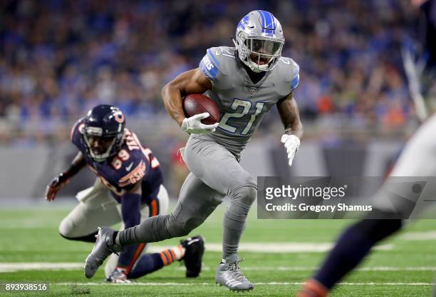 Detroit Lions cornerback Darius Slay runs with the ball past Chicago Bears inside linebacker Danny Trevathan during the third quarter at Ford Field...