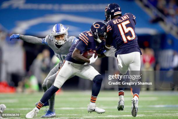 Chicago Bears wide receiver Kendall Wright looks to run the ball against Detroit Lions cornerback Teez Tabor during the second half at Ford Field on...