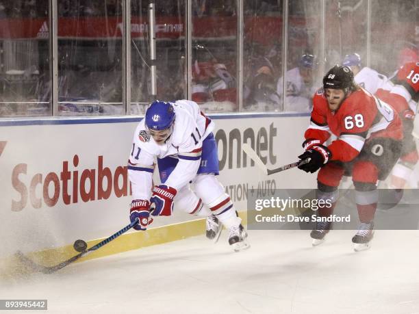 Brendan Gallagher of the Montreal Canadiens dives after a loose puck with Mike Hoffman of the Ottawa Senators chasing during the 2017 Scotiabank...