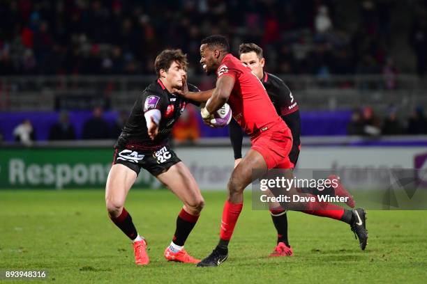 Wandie Mjekevu of Toulouse hands off Pierre Louis Barassi of Lyon during the European Rugby Challenge Cup match between Lyon OU and Stade Toulousain...