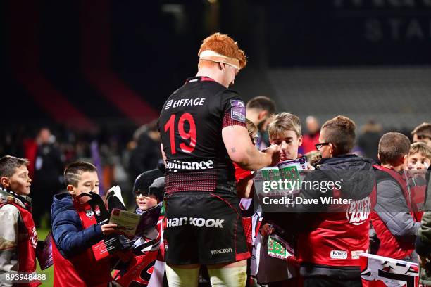 Felix Lambey of Lyon signs autographs following the European Rugby Challenge Cup match between Lyon OU and Stade Toulousain at Stade Gerland on...