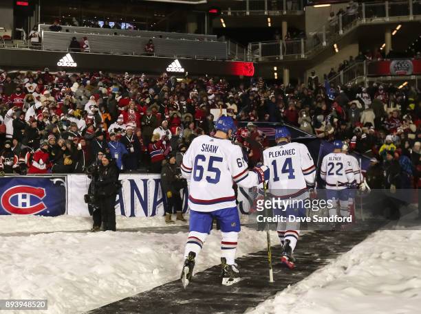 Andrew Shaw, Tomas Plekanec and Karl Alzner of the Montreal Canadiens leave the ice at the end of the first period in a game against the Ottawa...