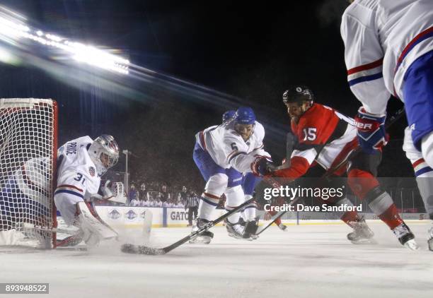 Zack Smith of the Ottawa Senators battles for a loose puck with Carey Price and Shea Weber of the Montreal Canadiens during the 2017 Scotiabank...