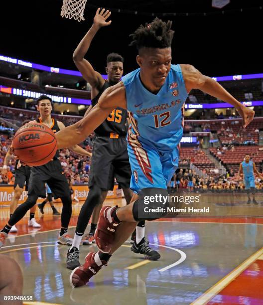 Florida State's Ike Obiagu grabs a rebound against Oklahoma State during the Orange Bowl Basketball Classic at the BB&T Center in Sunrise, Fla., on...