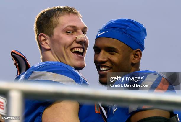 Leighton Vander Esch and Cedrick Wilson of the Boise State Broncos smile after the Broncos defeated the Oregon Ducks in the Las Vegas Bowl at Sam...