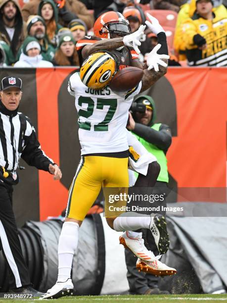 Wide receiver Josh Gordon of the Cleveland Browns is contacted by safety Josh Jones of the Green Bay Packers, as he attempts to catch a pass in the...