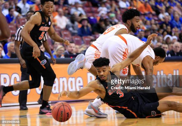 Florida's Jalen Hudson scrambles for a loose ball against Clemson during the Orange Bowl Basketball Classic at the BB&T Center in Sunrise, Fla., on...