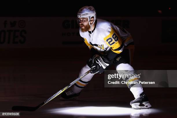 Ian Cole of the Pittsburgh Penguins skates on the ice before the start of the NHL game against the Arizona Coyotes at Gila River Arena on December...