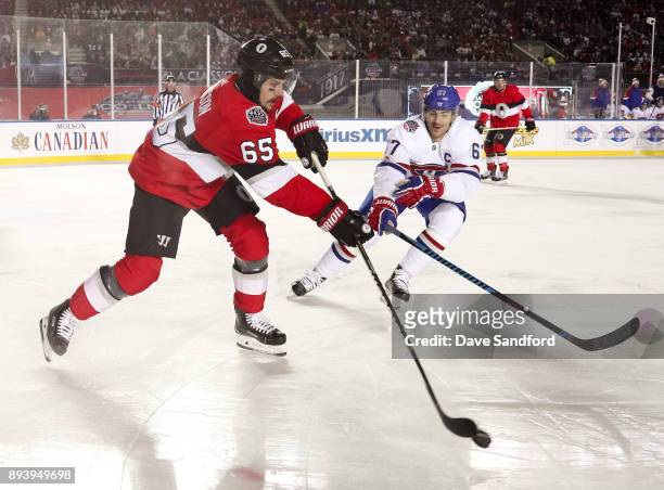 Erik Karlsson of the Ottawa Senators gets a pass off with pressure from Max Pacioretty of the Montreal Canadiens during the 2017 Scotiabank NHL100...