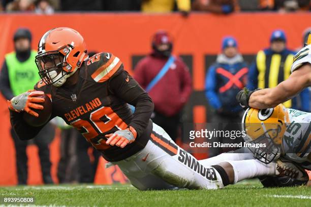 Running back Duke Johnson Jr. #29 of the Cleveland Browns is tackled by linebacker Vince Biegel of the Green Bay Packers in the third quarter of a...