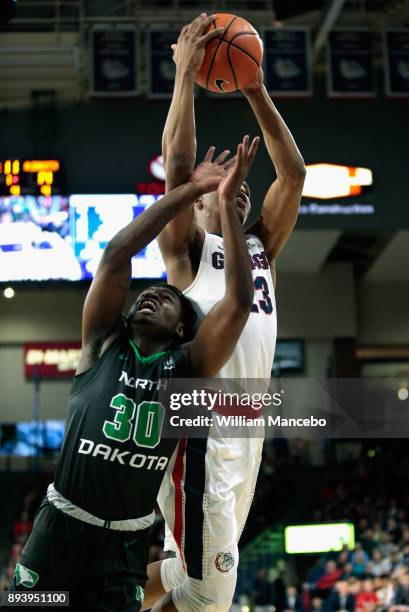 Zach Norvell Jr. #23 of the Gonzaga Bulldogs secures an offensive rebound against Tray Buchanan of the North Dakota Fighting Hawks in the first half...