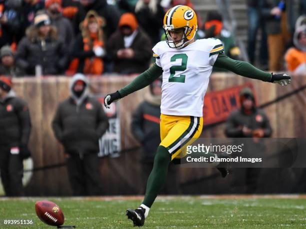Kicker Mason Crosby of the Green Bay Packers pauses on a kickoff as the ball is blown off the tee by the wind in the fourth quarter of a game on...