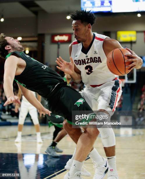 Conner Avants of the North Dakota Fighting Hawks draws a foul from Johnathan Williams of the Gonzaga Bulldogs in the first half at McCarthey Athletic...