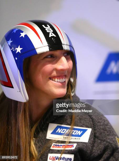 Erin Hamlin tries on the Team USA helmet during the Ice Ball to honor the nominees to the USA Olympic team at the Conference Center at Lake Placid on...