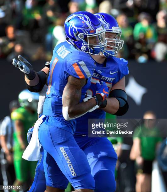 Cedrick Wilson and Mason Hampton of the Boise State Broncos celebrate after a touchdown against the Oregon Ducks the Las Vegas Bowl at Sam Boyd...