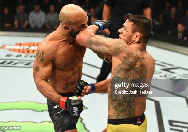 Rafael Dos Anjos of Brazil elbows Robbie Lawler in their welterweight bout during the UFC Fight Night event at Bell MTS Place on December 16, 2017 in...