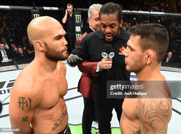 Robbie Lawler and Rafael Dos Anjos of Brazil face off in their welterweight bout during the UFC Fight Night event at Bell MTS Place on December 16,...