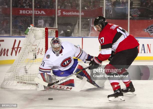 Nate Thompson of the Ottawa Senators carries the puck in on Carey Price of the Montreal Canadiens during the 2017 Scotiabank NHL100 Classic at...