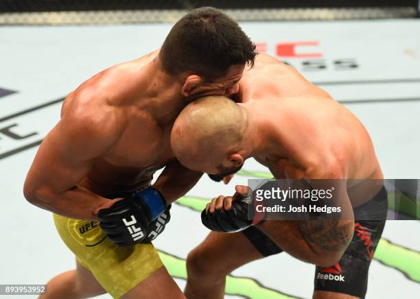 Robbie Lawler accidentally butts heads with Rafael Dos Anjos of Brazil in their welterweight bout during the UFC Fight Night event at Bell MTS Place...