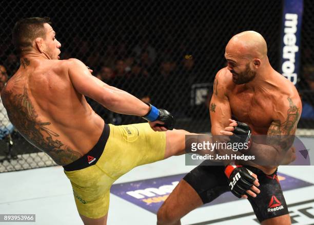 Rafael Dos Anjos of Brazil kicks Robbie Lawler in their welterweight bout during the UFC Fight Night event at Bell MTS Place on December 16, 2017 in...