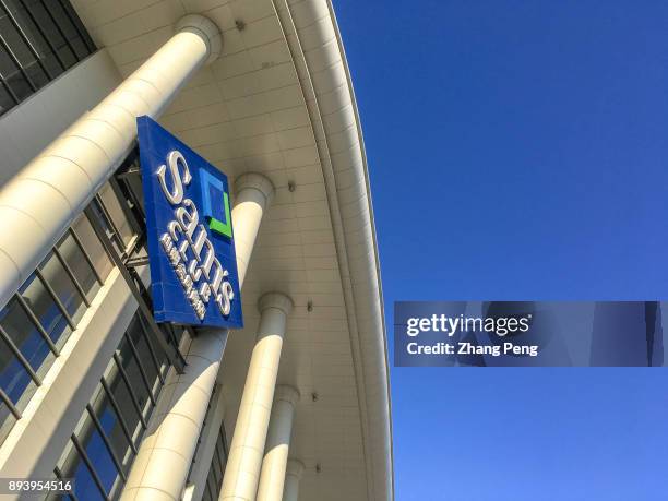 Logo of Sam's Club hangs high on the exterior of a building. At present, three of the top five Sams Club stores in the world are in China....