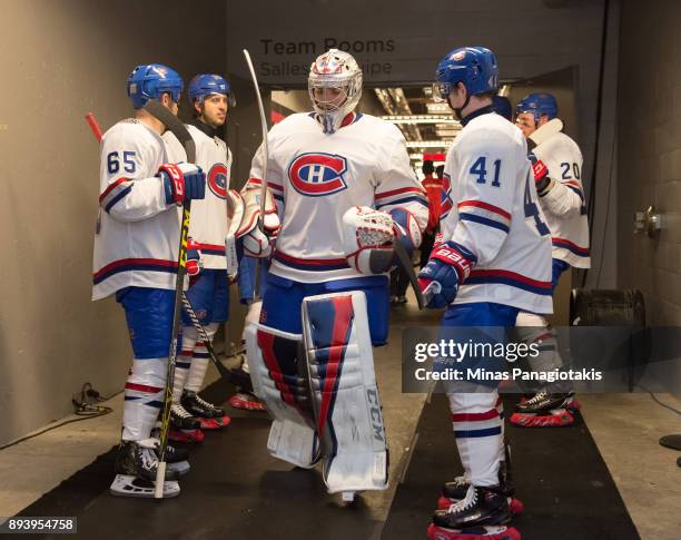 Carey Price, Andrew Shaw and Paul Byron of the Montreal Canadiens walk to the ice at the start of the second period in a game against the Ottawa...