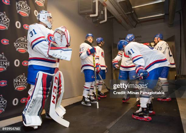 Carey Price, Andrew Shaw and Paul Byron of the Montreal Canadiens prepare to start the second period in a game against the Ottawa Senators during the...
