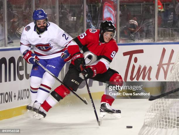 David Schlemko of the Montreal Canadiens battles for a loose puck with Matt Duchene of the Ottawa Senators during the 2017 Scotiabank NHL100 Classic...